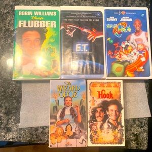 VHS family films: Flubber, E.T., Space Jam, Hook, Wizard of Oz